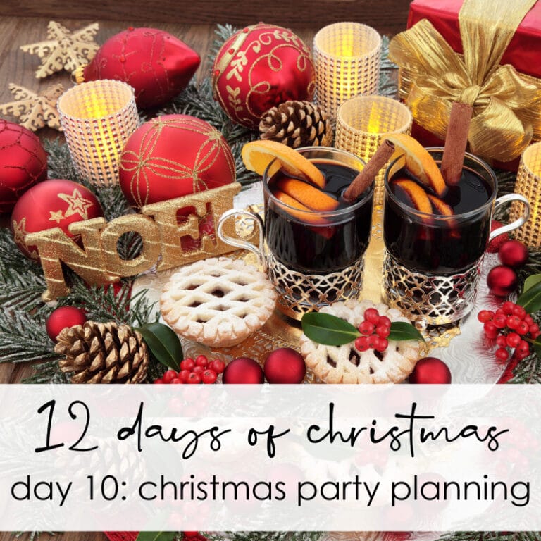 Festive Christmas decorations with red ornaments, holiday candles, cookies, and mulled wine, perfect for Christmas party planning and holiday celebration ideas.