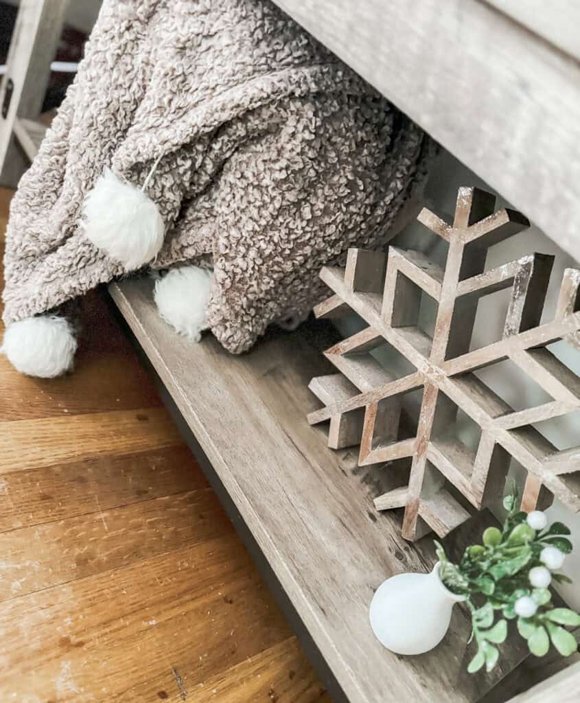 pom poms on blankets for cozy winter decor