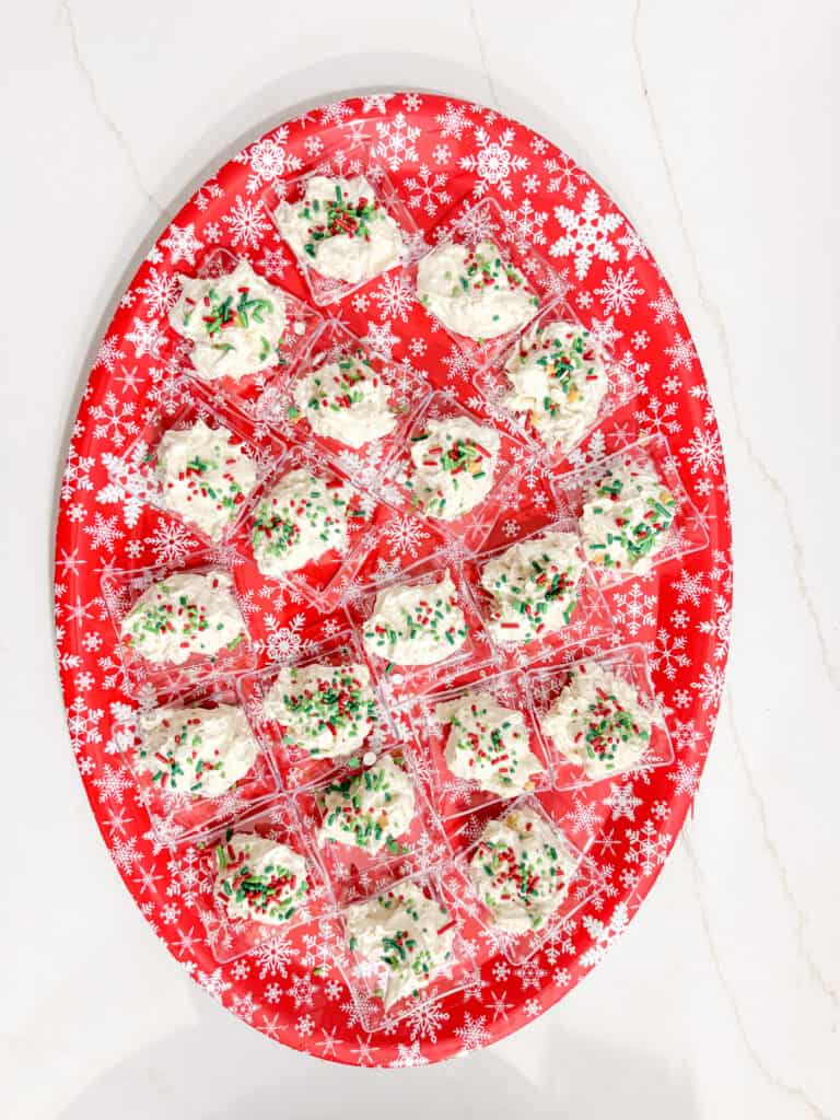 christmas tree dip individually served in mini trays with christmas sprinkles