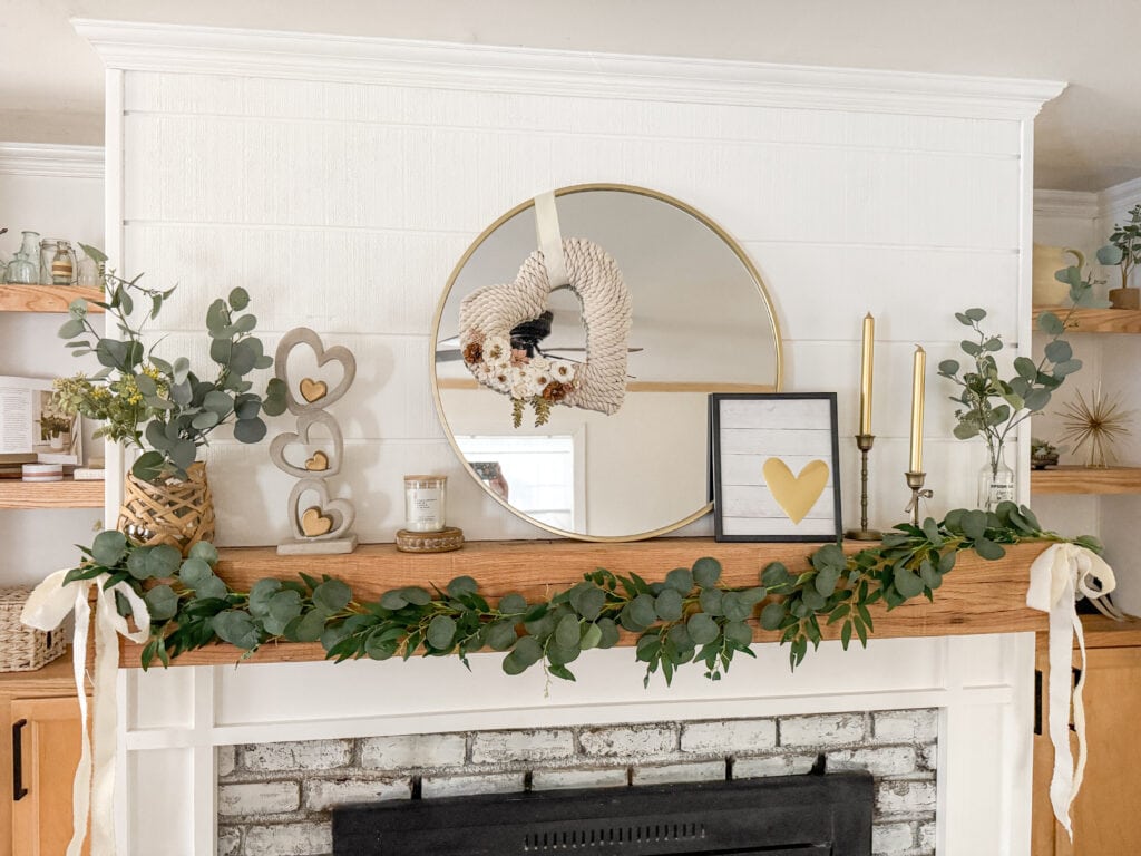 valentine mantel in neutral subtle color palette with white, cream greens, gold, wood