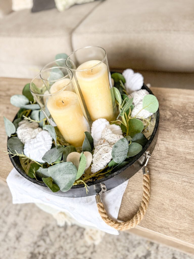 valentine table tray centerpiece in neutral subtle decor with candles, greens, white hearts