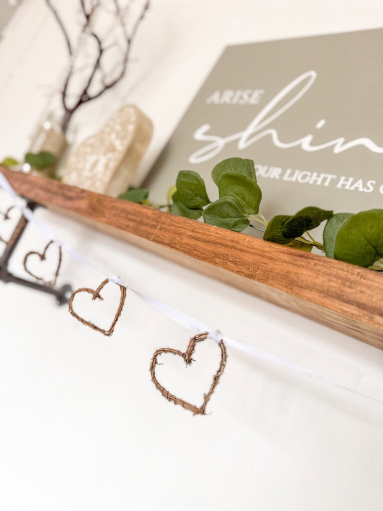 grapevine heart garland on shelf with valentine decor
