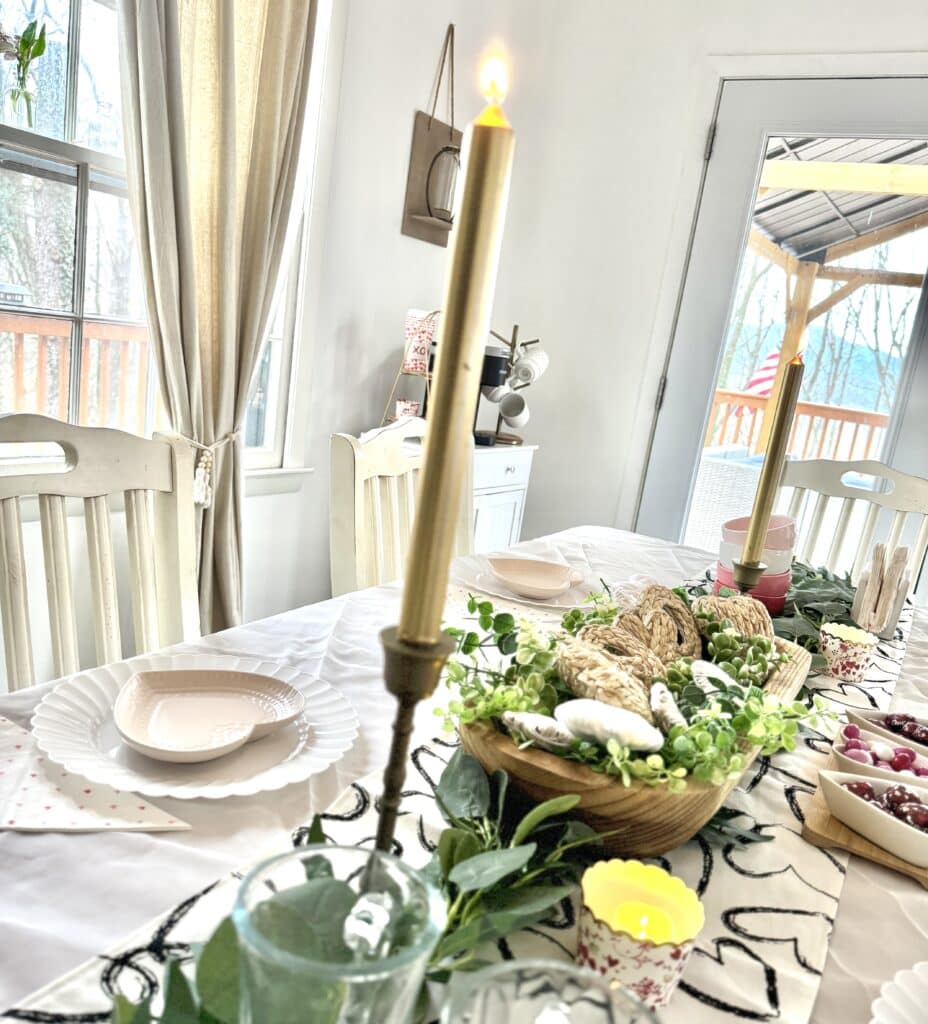 table with gold candlesticks for valentine's day table