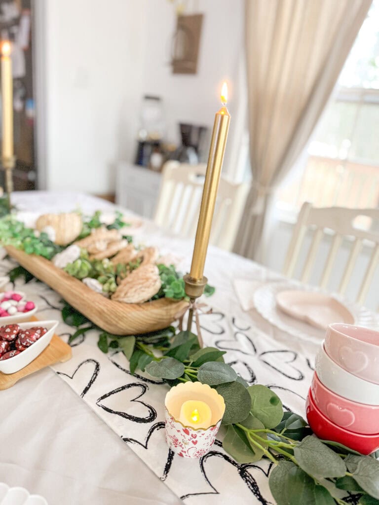 valentine candle and eucalyptus garland and table decor