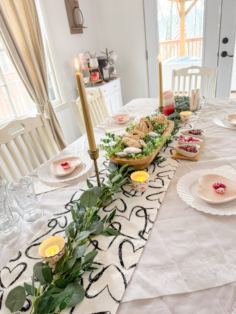 lit candles on valentines table