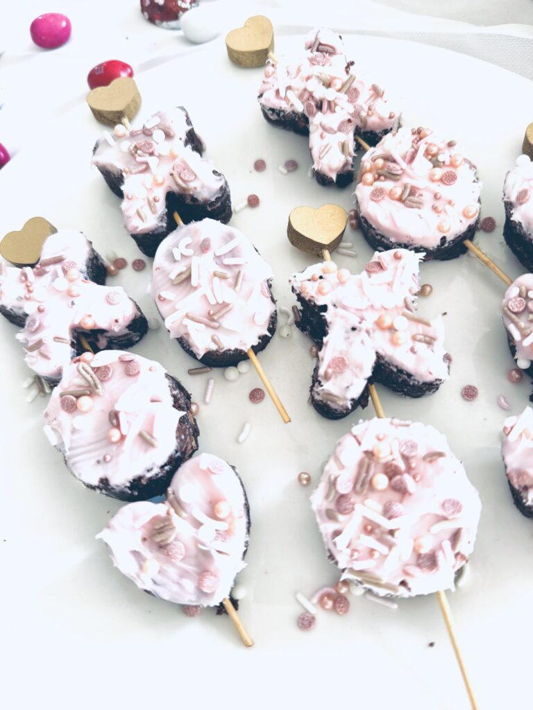 brownie xo heart kabobs on skewers with pink icing and sprinkels