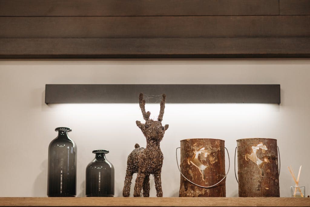 A warm indoor setting with rustic decor including vases and a reindeer ornament.