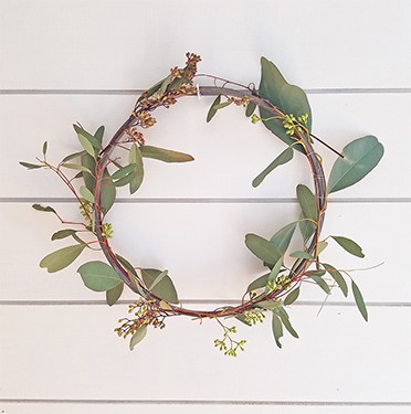 Handmade eucalyptus and floral wreath for spring and summer decor, crafted with natural materials and rustic charm. Perfect for weddings, events, or home decoration.