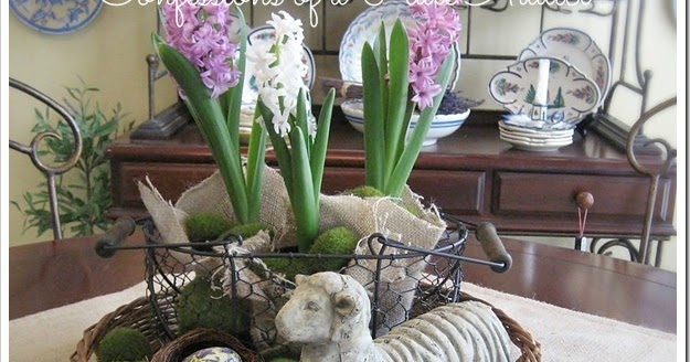 Colorful hyacinth and snowdrop Easter flowers arrangement in rustic basket on dining table, perfect for spring and Easter celebrations.