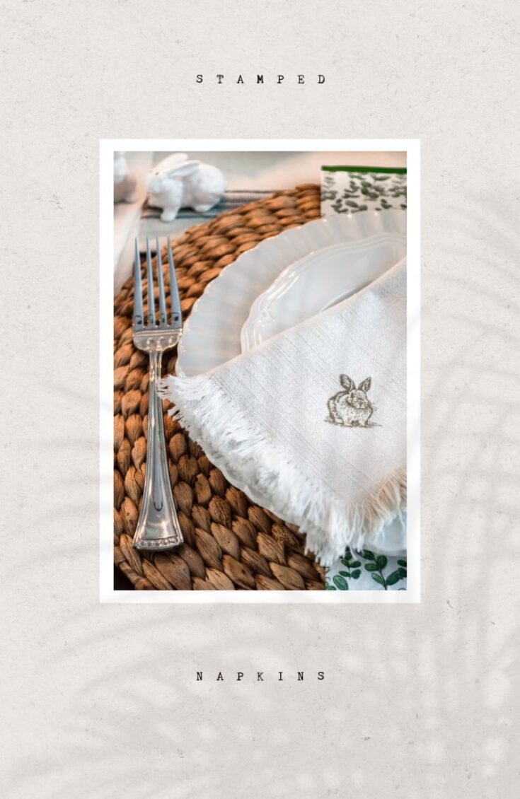 Delicate white napkin with a rabbit illustration, set on a dining table with a woven placemat and elegant tableware, perfect for rustic or spring-themed tablescapes.