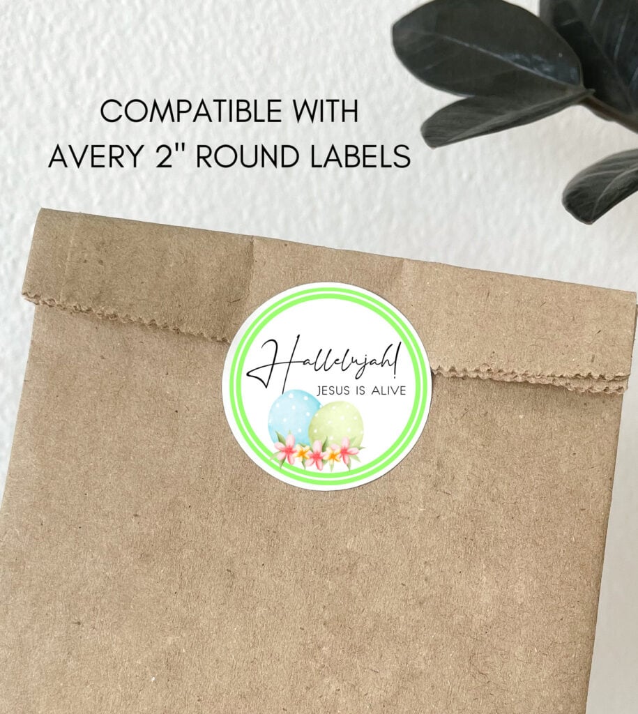 Bright Easter sticker with pastel eggs, pink flowers, and a Christian message for celebrating Jesus' resurrection, compatible with Avery 2-inch round labels.