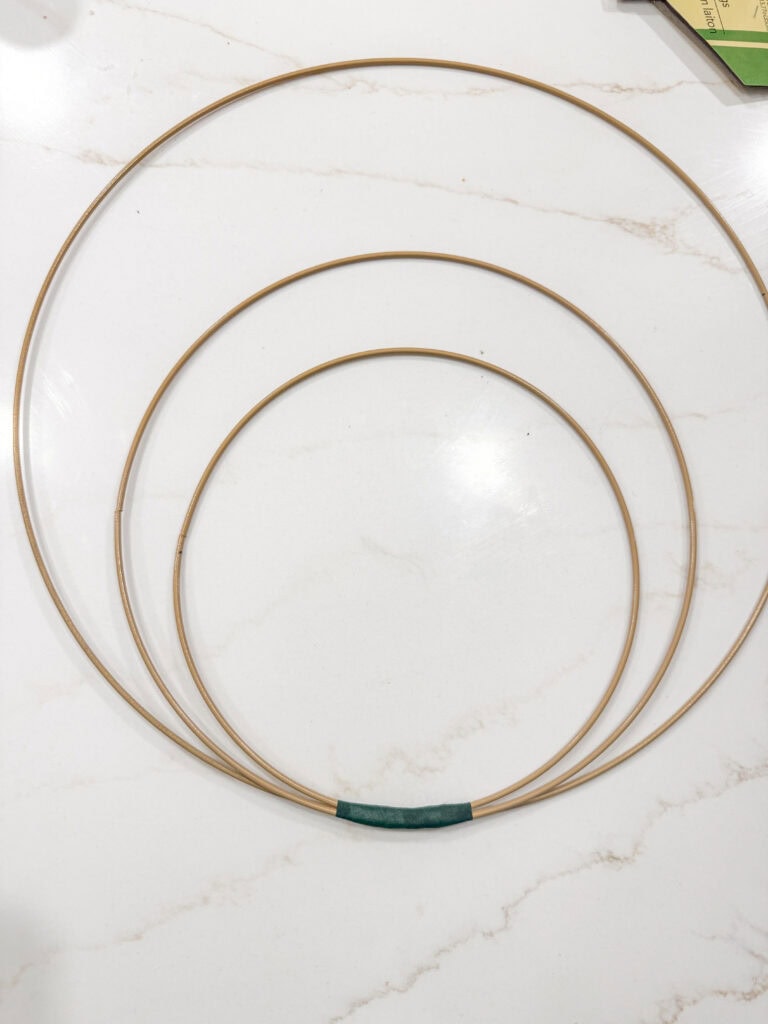 attached metal hoop wreaths with floral tape