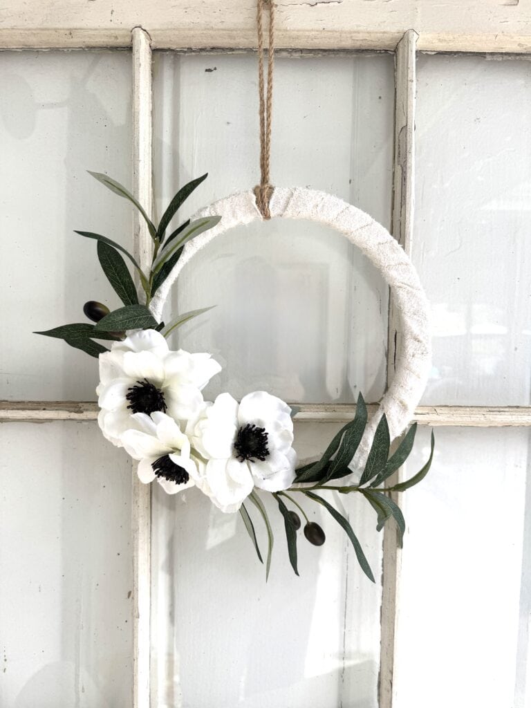 Christian Easter wreath on wood frame window