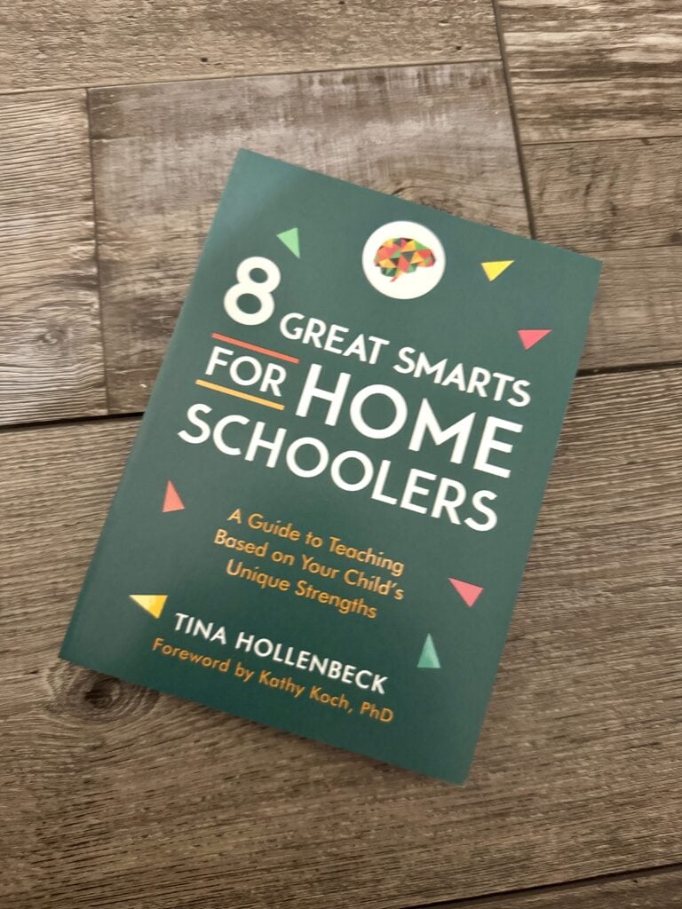 8 Great Smarts for Home Schoolers book cover with colorful geometric design and wooden background.
