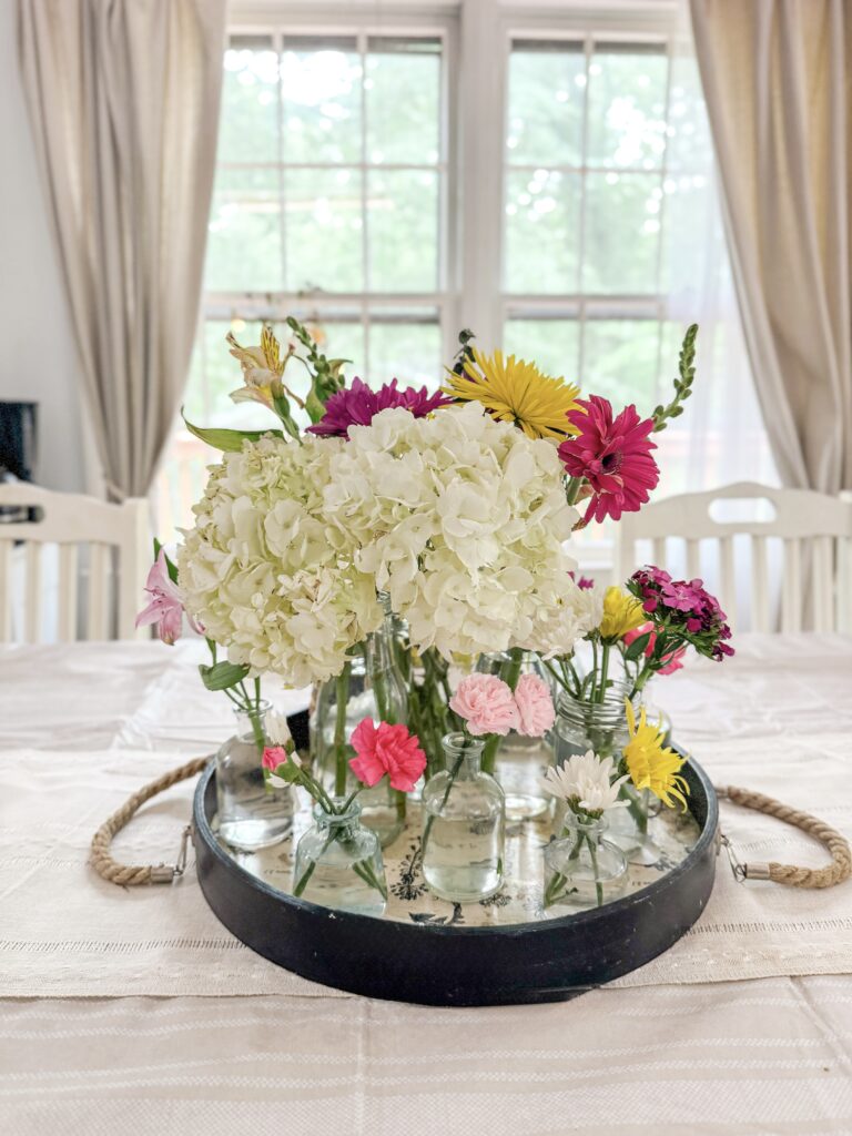 summer blooms in black tray for centerpiece idea