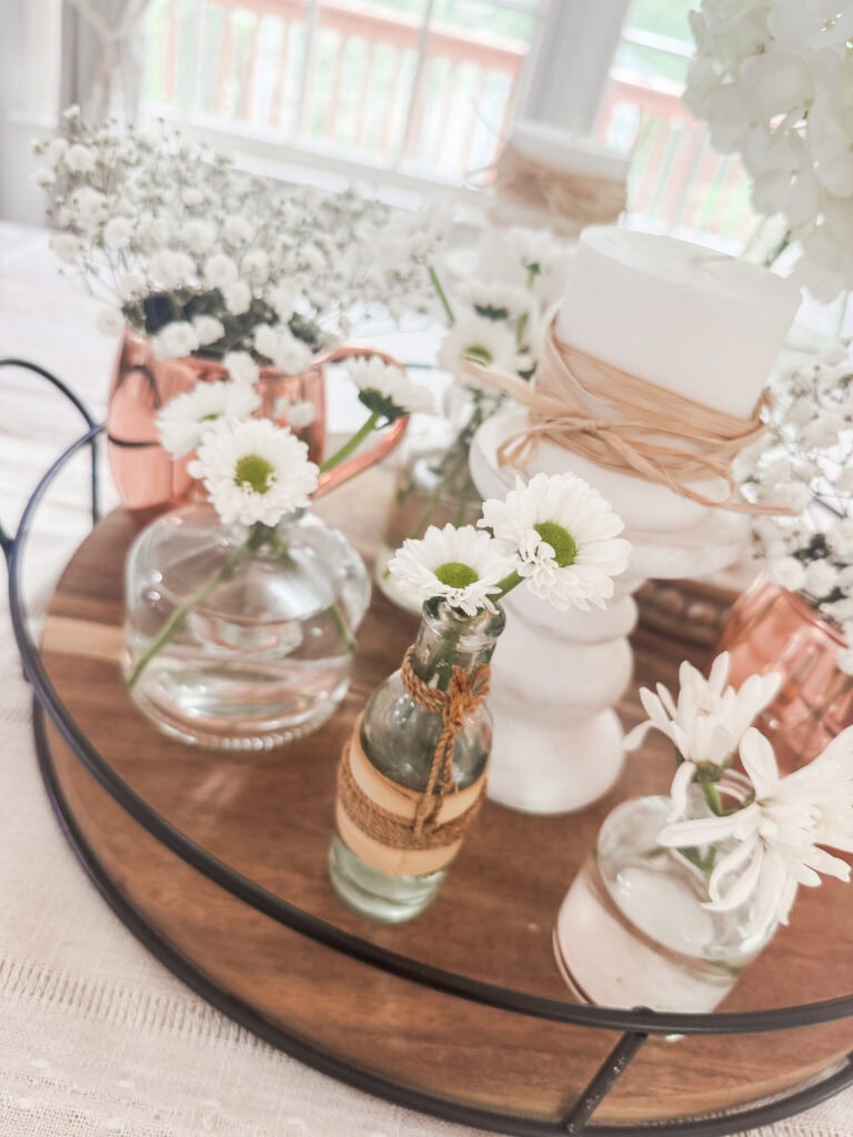 bud vases and white flowers for neutral centerpiece