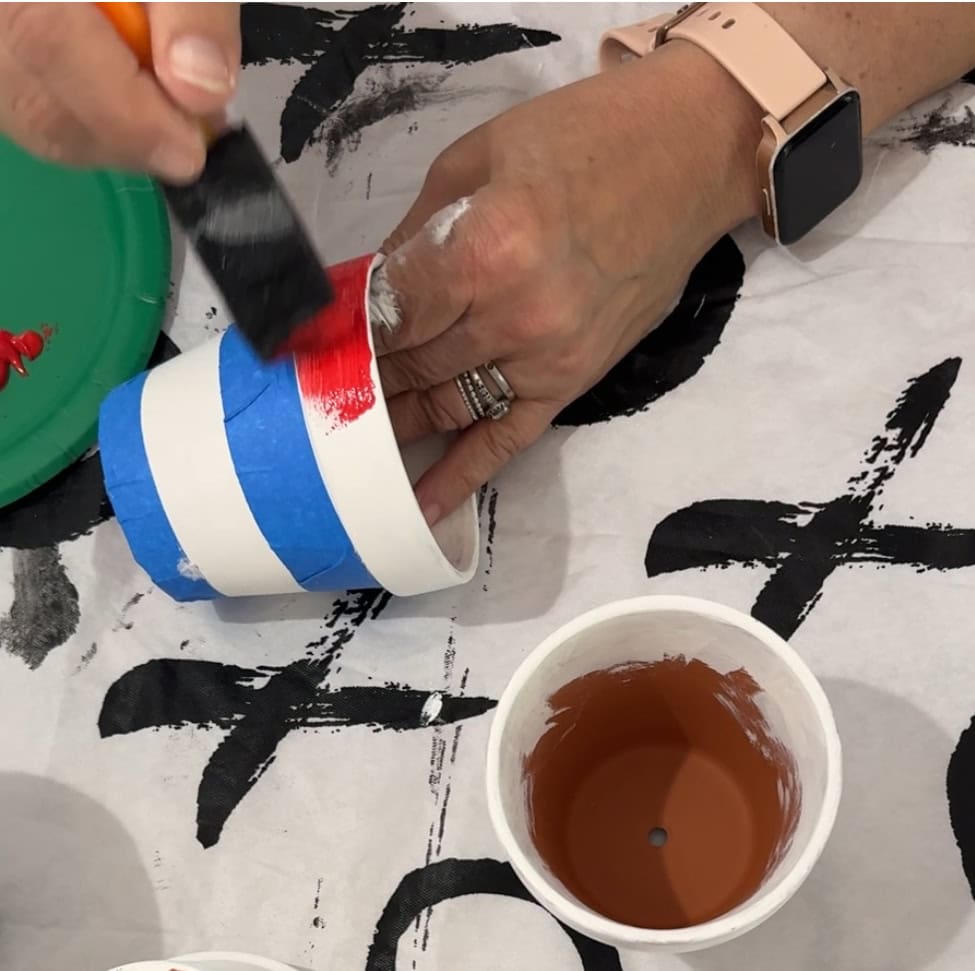 red paint on flower pot for strips