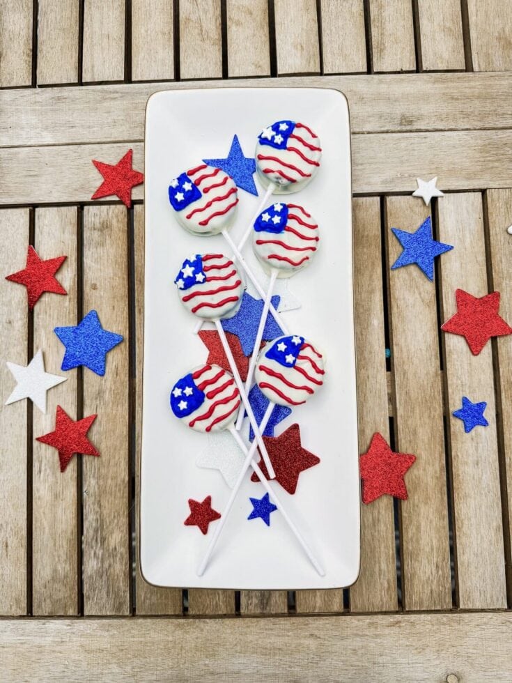 Patriotic American-themed cake pops with red, white, and blue star and stripe designs, perfect for Fourth of July celebrations or patriotic parties.