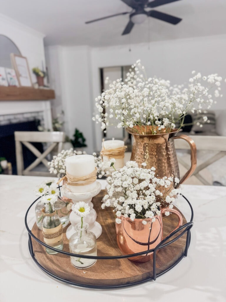 copper water pitcher and mules with baby's breath for neutral summer centerpiece
