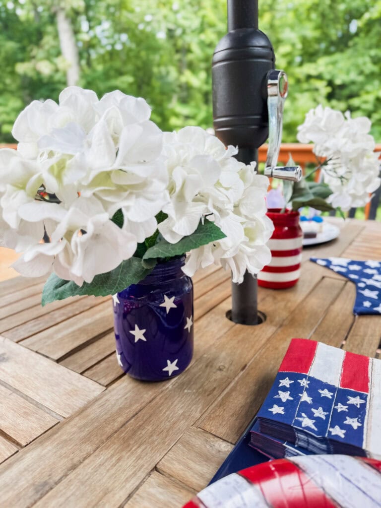 blue patriotic vase with white hydrangeas