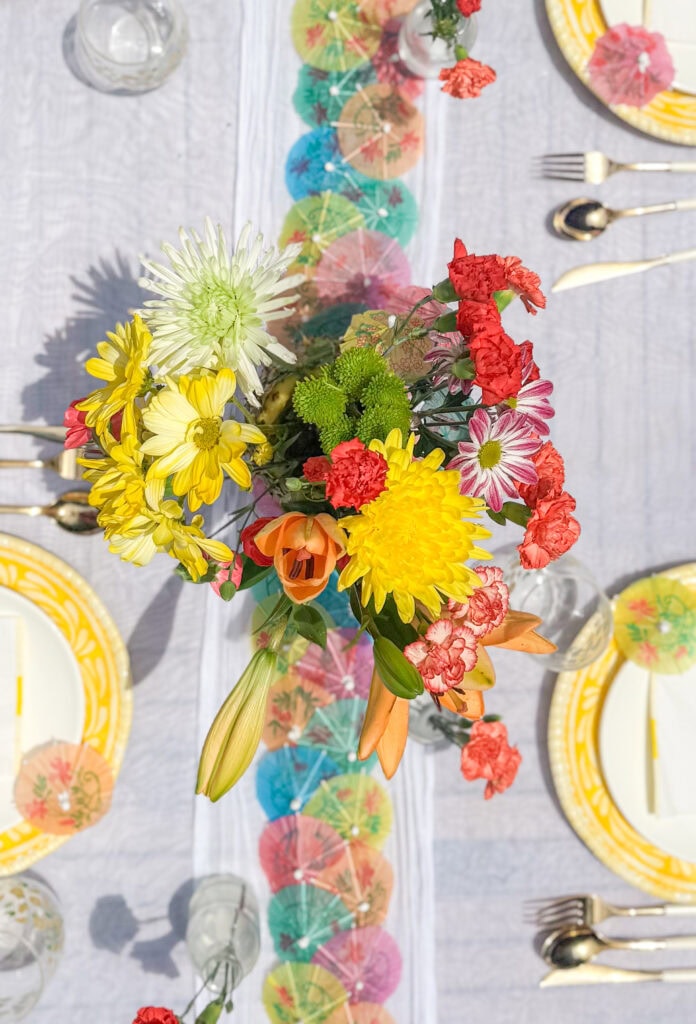 top view of pineapple centerpiece with bright floral colors