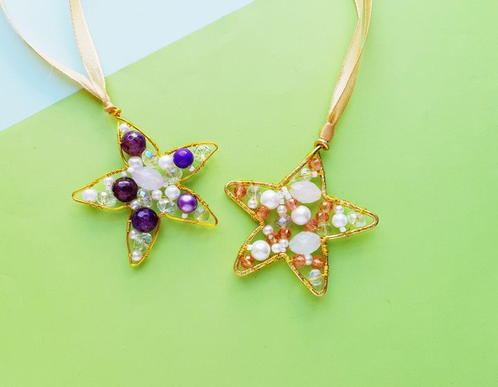 Colorful beaded star ornaments with gold wire accents, perfect for holiday decorations or gift embellishments.