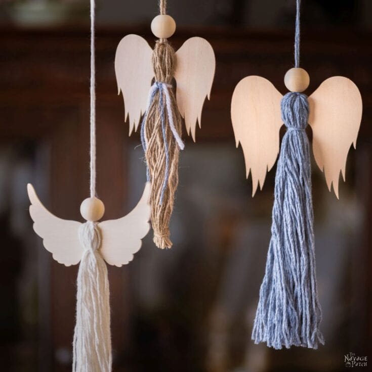 Delicate wooden angel ornaments with yarn tassels, perfect for handmade holiday decorations and angel-themed crafts.