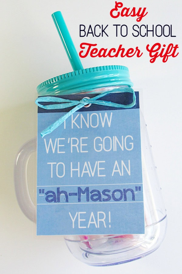 Back to school teacher gift with mason jar, pink straw, and handwritten note for teacher appreciation and classroom celebration.