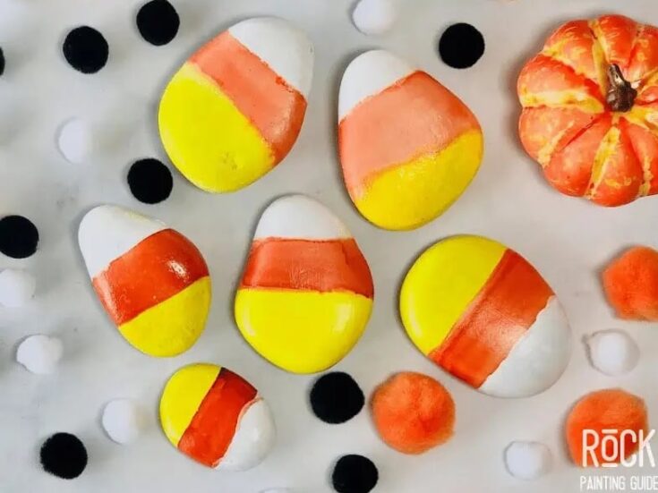 Colorful candy corn marbled cookies with fall-themed decor, perfect for Halloween or autumn celebrations. Bright yellow, orange, white, and red accents enhance festive seasonal treats.