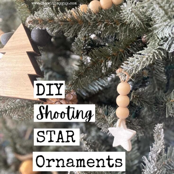 Beaded star ornament hanging on Christmas tree with DIY shooting star theme, natural wood beads and white star, festive holiday decorations, rustic winter decor, handcrafted Christmas ornament.