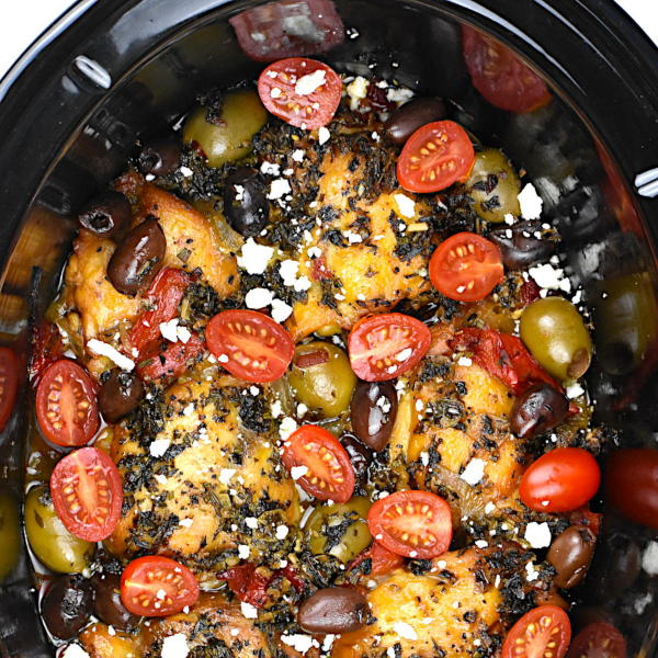 Juicy roasted chicken thighs topped with cherry tomatoes, black olives, and feta cheese in a flavorful Mediterranean-inspired dish. Perfect for healthy family meals and easy dinner recipes.