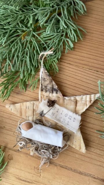 Delightful handmade star ornament with cozy fabric details, natural twine hanging loop, and rustic charm, perfect for Christmas tree decor and home holiday accents.