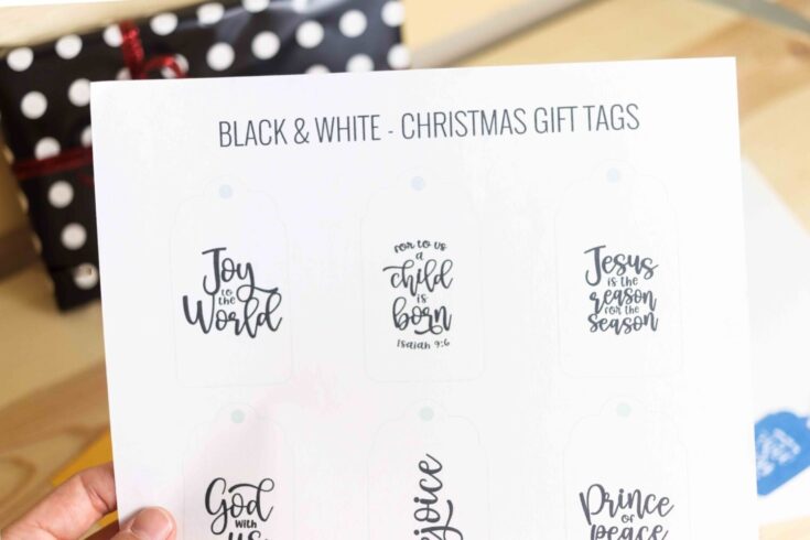 Inspirational Christmas gift tags with black and white designs featuring biblical and seasonal messages, perfect for holiday gift wrapping and decorating.
