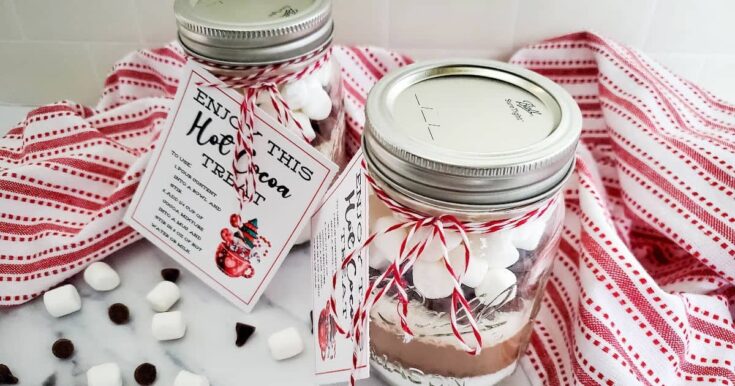 Deluxe hot chocolate mix in mason jars with festive red and white twine, perfect for holiday gifts and cozy winter celebrations at A Hundred Affections.