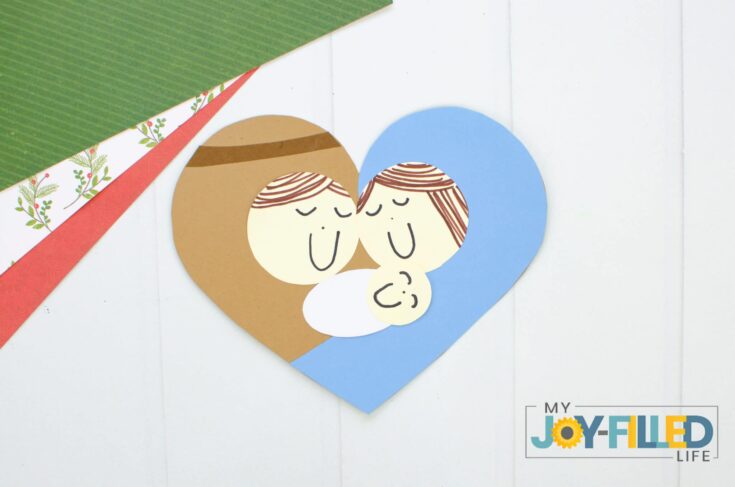 Sweet paper art depiction of Mary and baby Jesus with a heart shape, celebrating Christian Christmas spirit and faith.