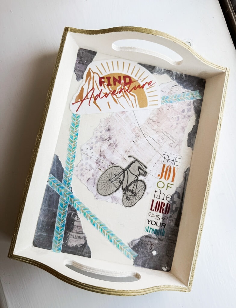 Inspirational ministry art with biblical verses, bicycle illustration, and encouraging words on a decorative tray, emphasizing faith, hope, strength, and finding joy in the Lord.