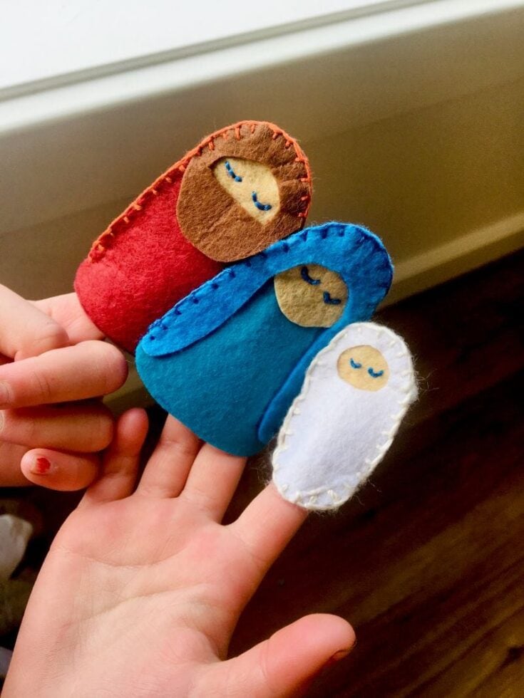 Little handmade felt baby Jesus, Mary, and Joseph plush toys representing nativity scene, perfect for religious Christmas decor or gifts, soft and cozy felt fabric, ideal for children.