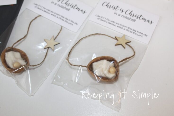 Handmade Christmas ornaments with natural wood stars, featuring white cotton stuffed inside small walnut shells, perfect for festive holiday decor.