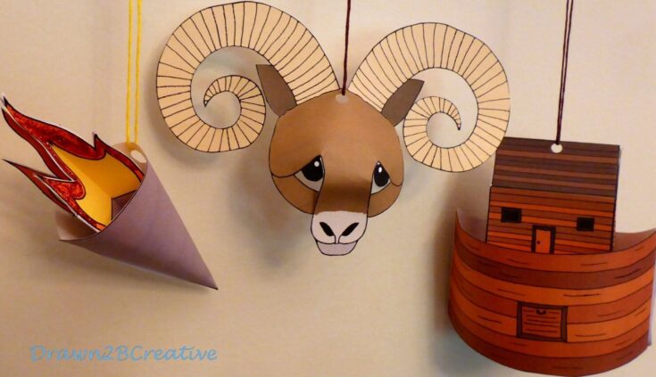 Colorful paper animal art crafts, including a ram's head with spiral horns, a wooden house, and a fire, displayed on a beige wall, perfect for DIY home decor or children's room decorations.