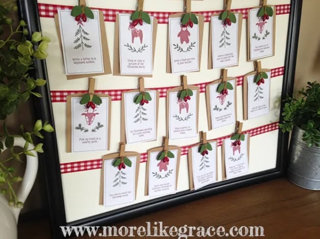 Handmade holiday advent calendar with festive cards, red checkered ribbons, and mini clothespins, perfect for Christmas decor and gift planning.