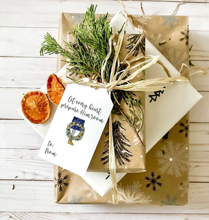 Fresh Christmas gift wrapped in festive paper with natural greenery, dried orange slices, and a heartfelt holiday tag, perfect for seasonal celebrations and gift-giving.