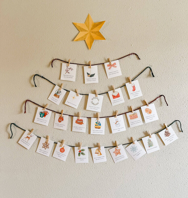 Colorful Christmas advent countdown with festive holiday cards hanging on strings with clothespins, decorated with a star on the beige wall, perfect for seasonal celebrations and gift-giving.
