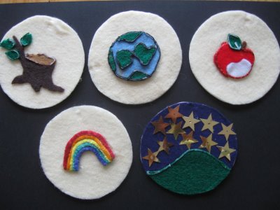 Colorful felt brooches featuring earth, tree, apple, rainbow, and stars designs for eco-friendly fashion accessories and handmade crafts.