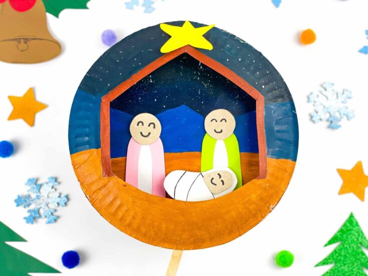 Bright nativity scene craft with smiling paper characters in a festive holiday setting, perfect for Christmas decorations and religious celebrations.