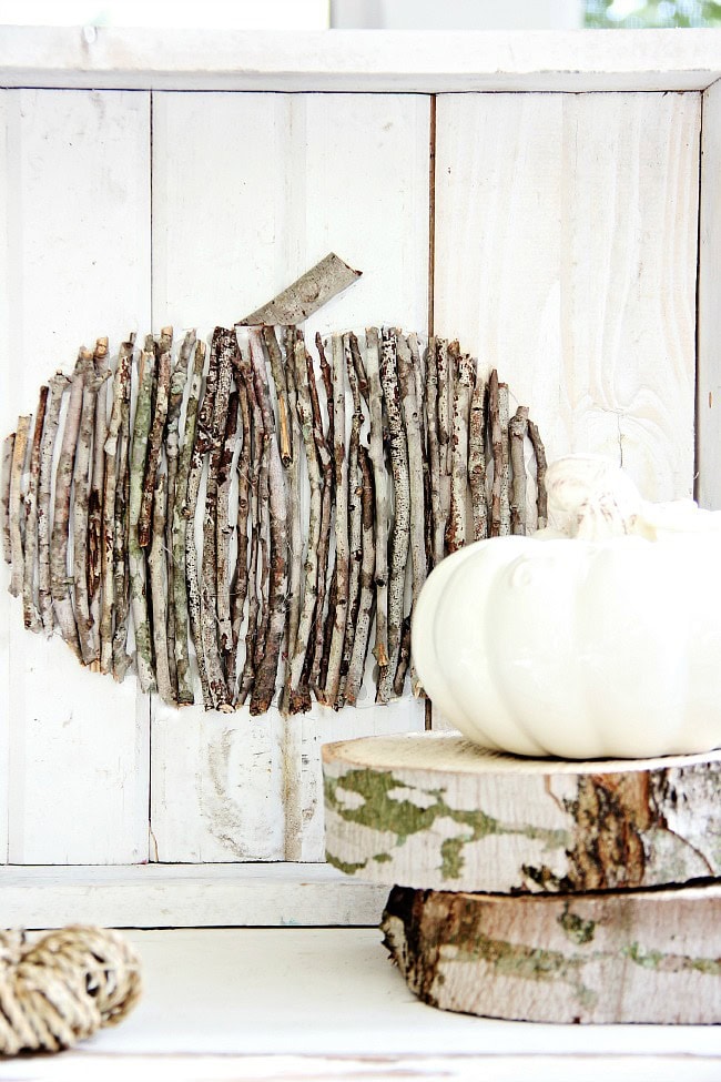 Birch wood pumpkin wall decor, rustic autumn craft, natural fall decor, DIY pumpkin art, fall floral arrangement, seasonal rustic centerpiece, wooden pumpkin design, handmade fall wreath, nature-inspired autumn decor, fall harvest home accents.