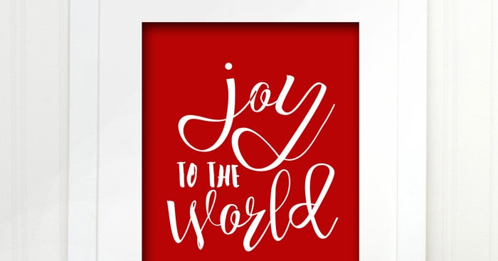 "Joy to the World" red and white holiday sign promoting festive cheer, perfect for home decor and Christmas celebrations.