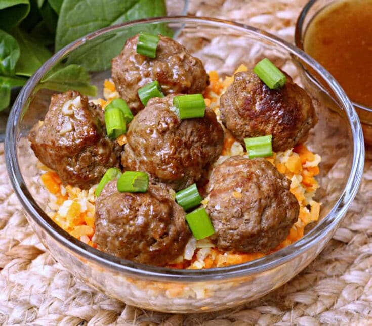 Savory Swedish meatballs served over creamy mashed potatoes with a rich gravy and garnished with chopped green onions. Perfect comfort food recipe for family dinners.