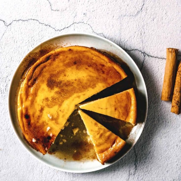 Creamy caramel flan dessert with a rich caramel topping, served in a white dish for a sweet treat. Perfect for dessert lovers and special occasions.