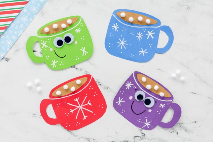 Colorful Christmas mug crafts with googly eyes and paper snowflake designs, perfect for holiday decorations and kids' craft activities.