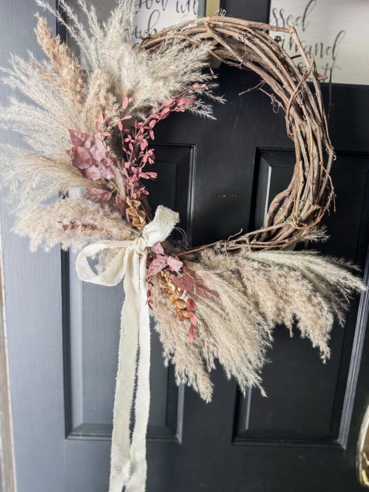 pampas grass DIY wreath on black door for fall